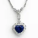 COLLAR de Oro Blanco de 18 Kilates con un Corazón de Tanzanita y con brillantes alrededor